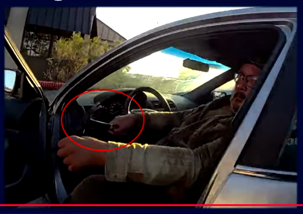 Police body-camera footage shows a man sitting in his vehicle holding a hammer before the Oct. 9 confrontation outside Chili’s on South Telshor Boulevard.