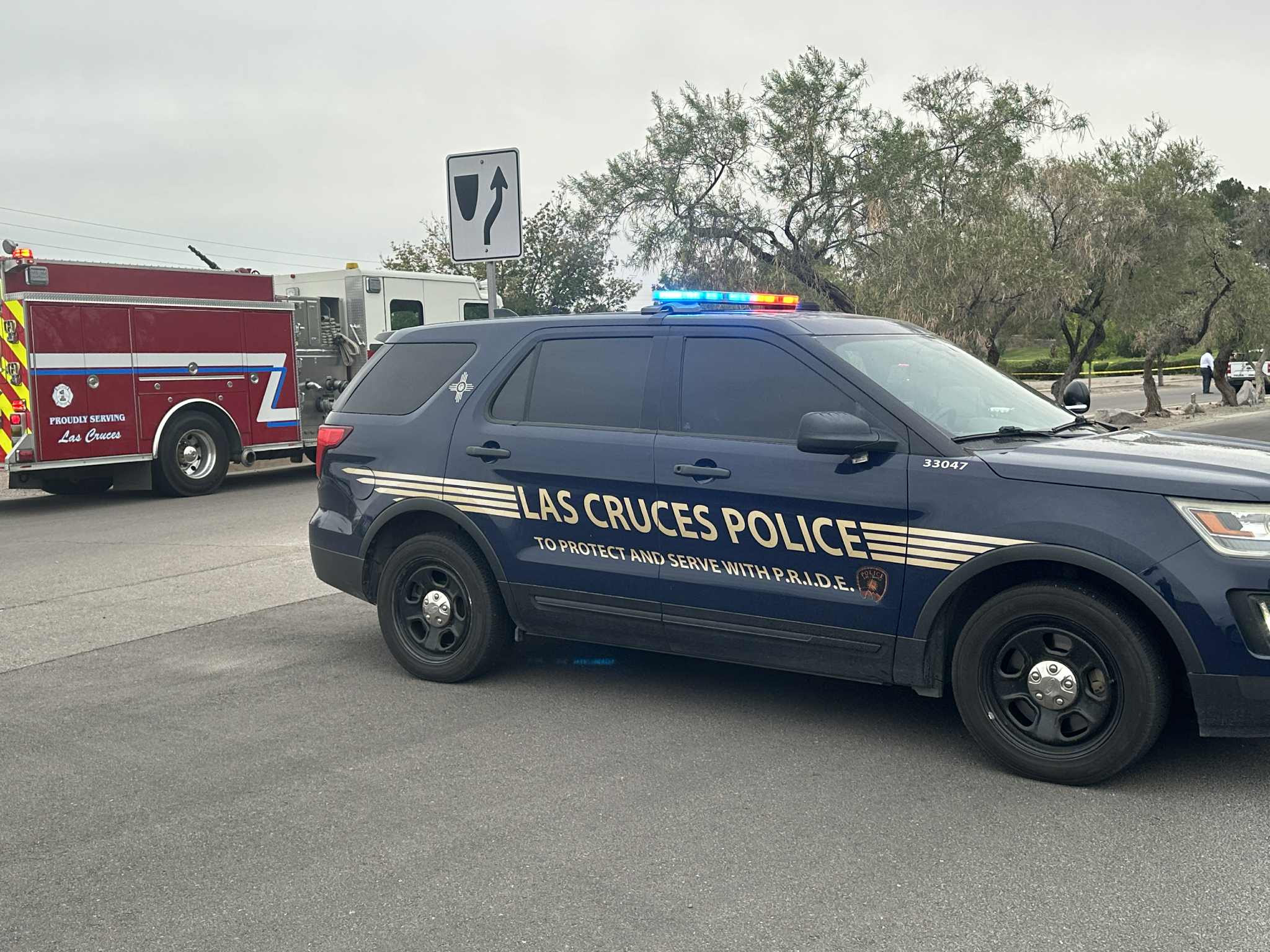 A Las Cruces Police Department SUV blocks a road near Salopek Park on Sept. 4, 2025, as an LCPD officer and a fire engine from Las Cruces Fire Department are seen in the background at an active scene.