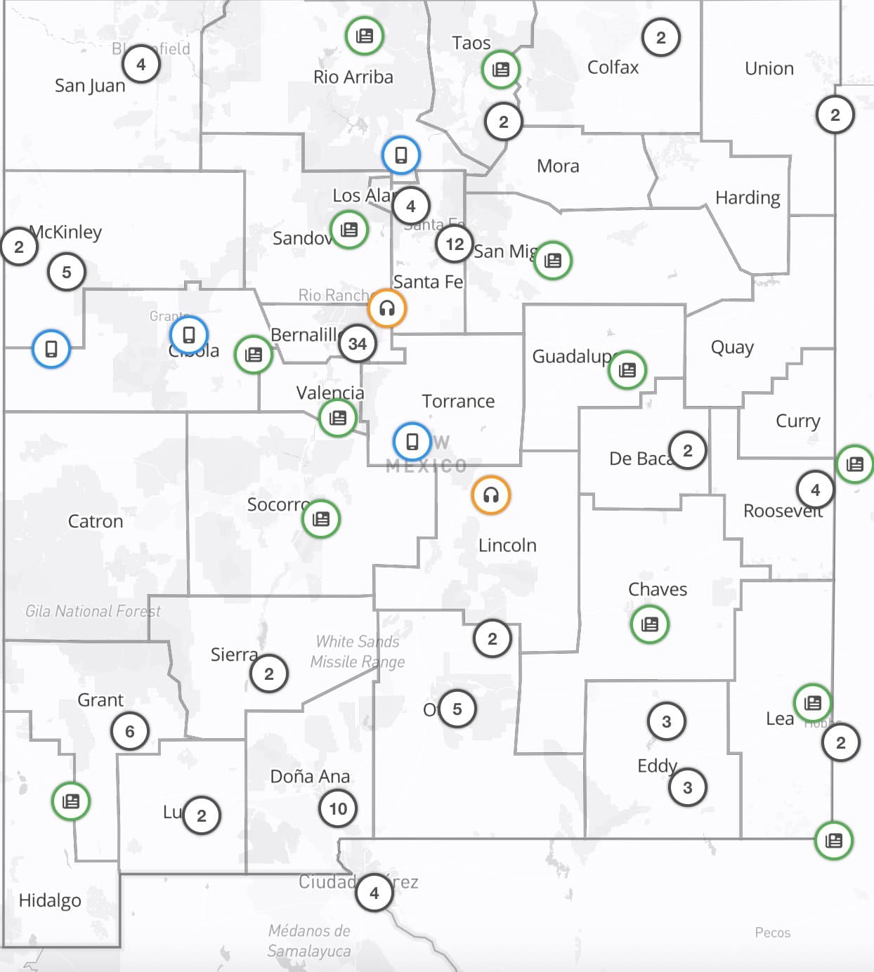 A statewide map of New Mexico showing county boundaries marked with icons and numbers that indicate the distribution of local news outlets across the state.