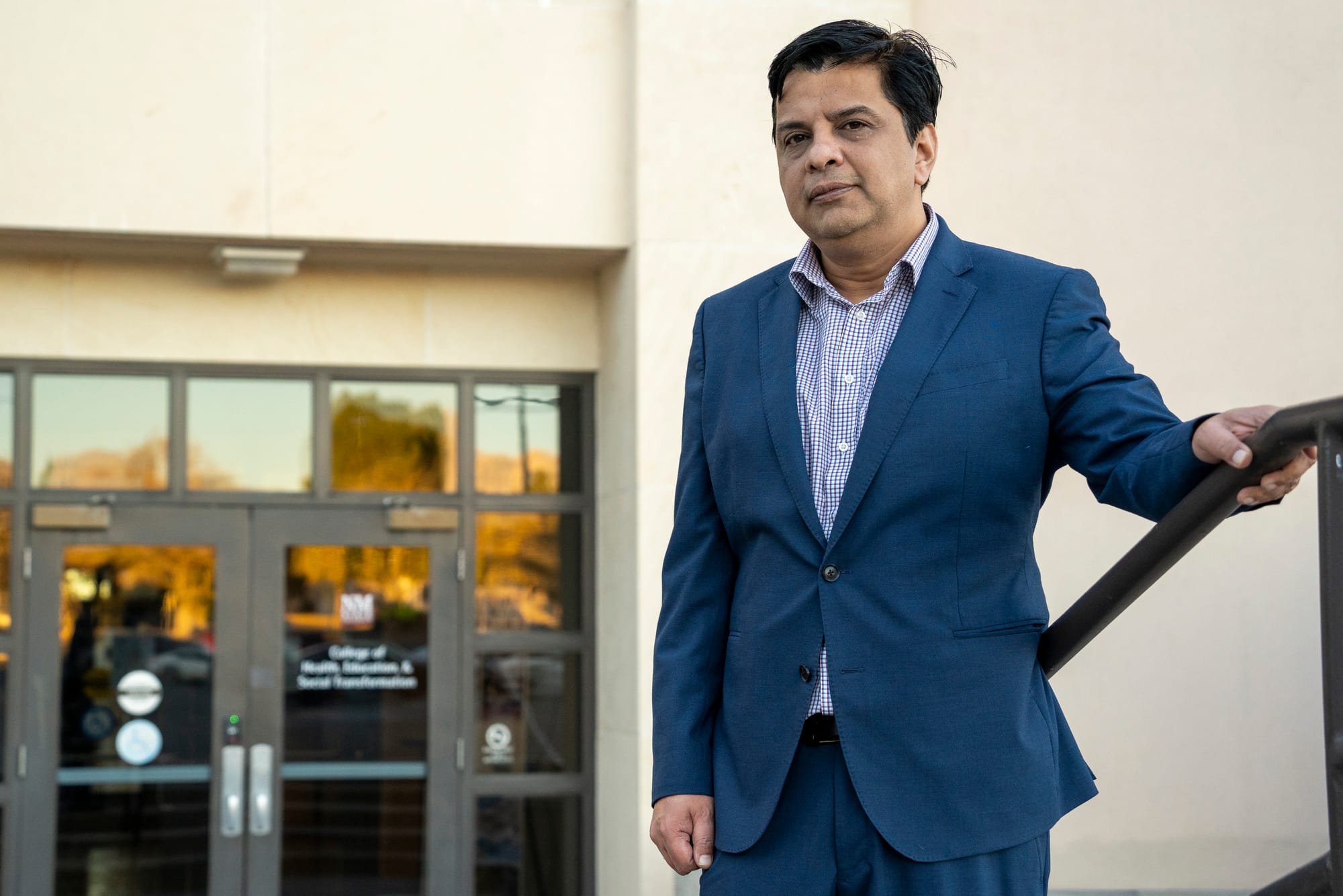 Dr. Jagdish Khubchandani, a professor of public health at New Mexico State University, stands outside the Health and Social Services Building on the Las Cruces campus.
