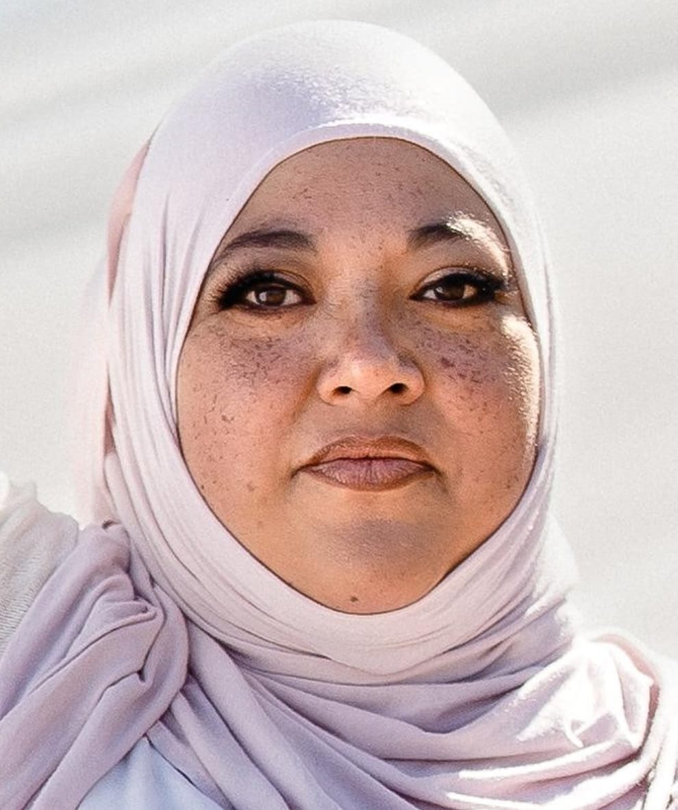 Daisy A. Maldonado, candidate for Doña Ana County Commission District 1, in a portrait photo wearing a light-colored hijab and floral top.