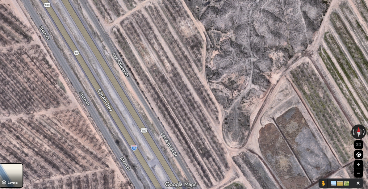 Satellite view showing Interstate 10 and pecan orchards near Las Alturas Drive east of the Interstate 10 and Interstate 25 interchange near Las Cruces.