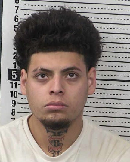 Booking photo of Jose Alonzo Enriquez Jr., a 22-year-old man arrested in Las Cruces.