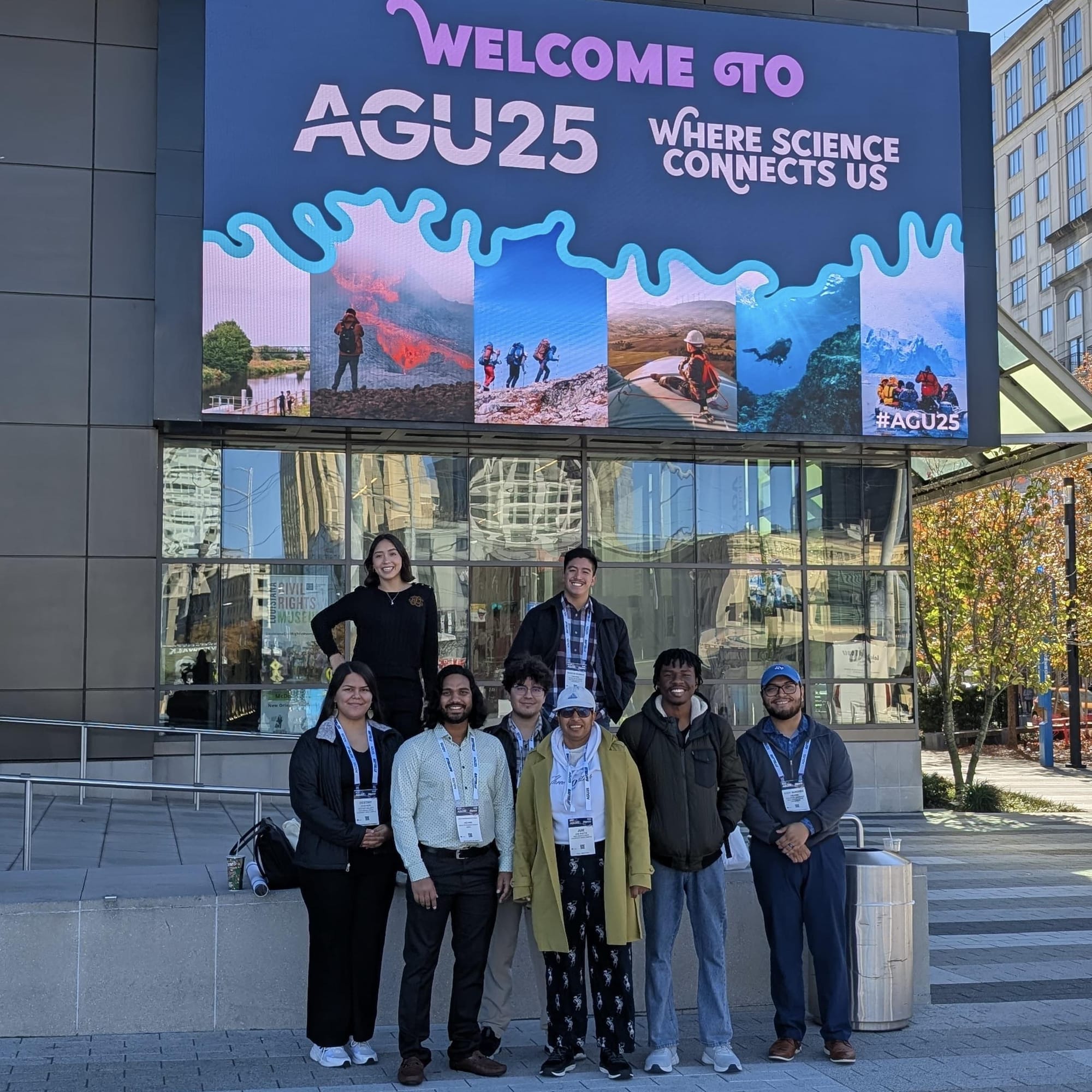 Juie Shetye and NMSU students pose in front of an AGU25 conference sign while attending the American Geophysical Union annual meeting.