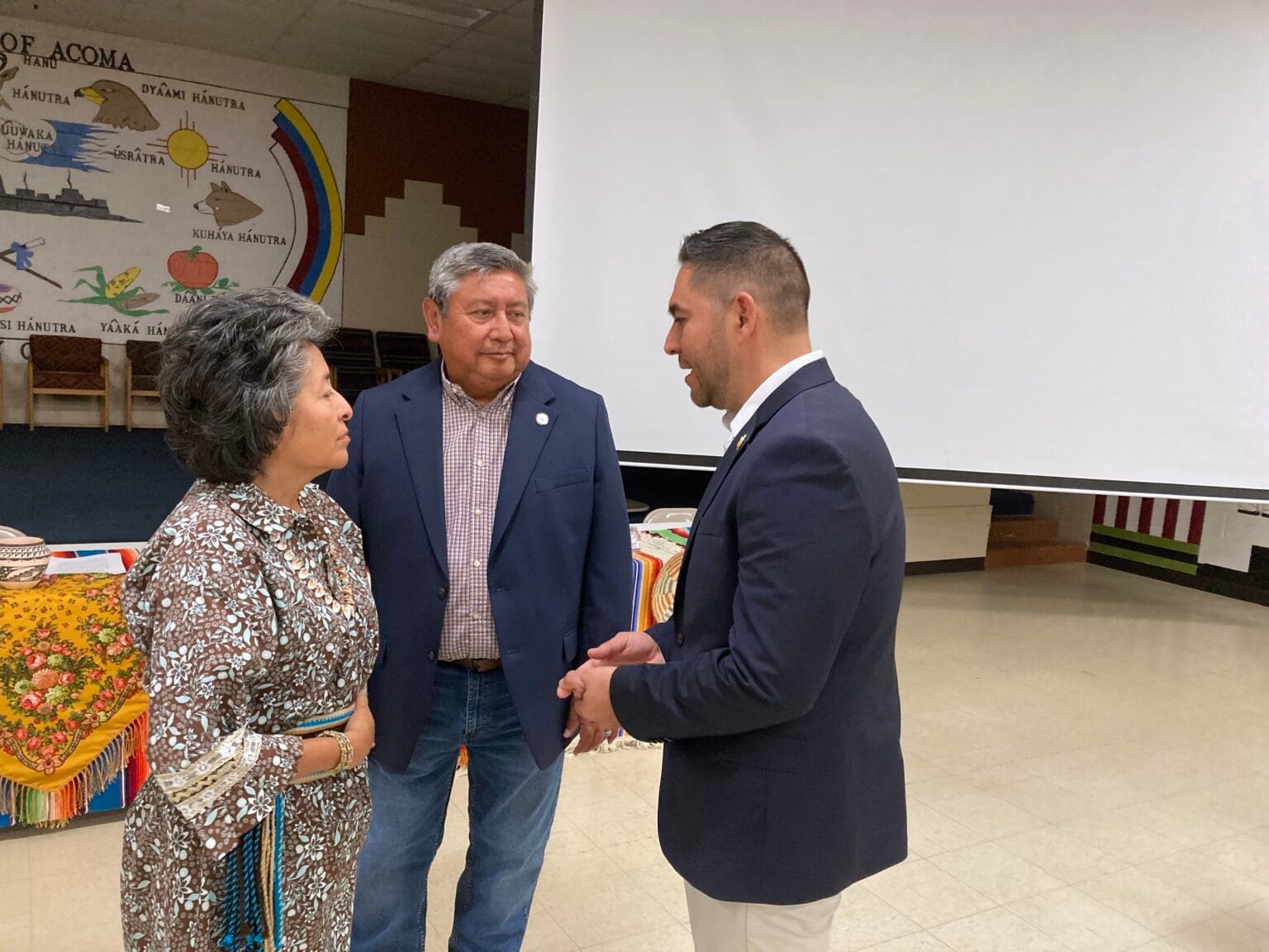 Pueblo of Acoma Gov. Charles Riley speaks with Cathy Riley and U.S. Rep. Gabe Vasquez during a town hall event.