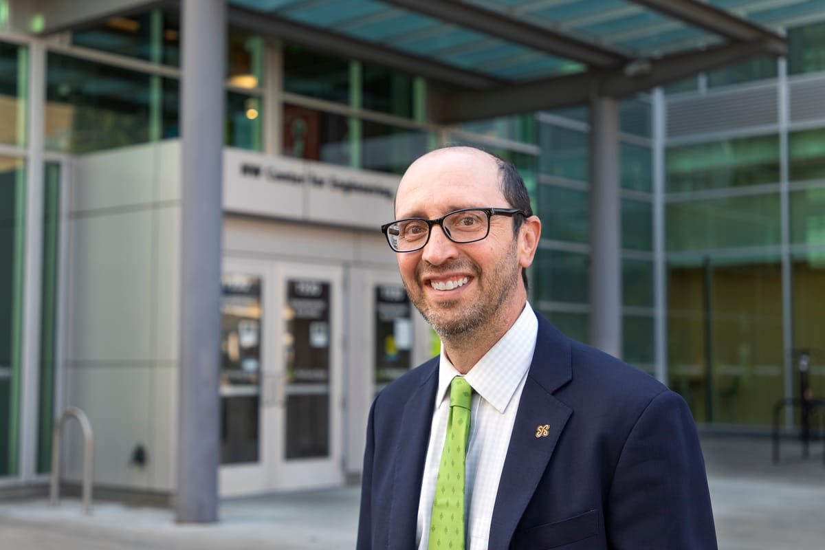 Joseph Bull stands outside a university building after being named NMSU’s next provost, pending approval
