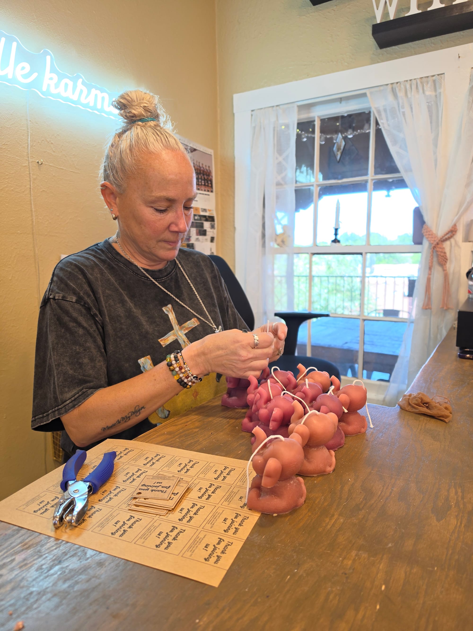 Kandle Karma owner Kerry Carmona works on handmade candles inside her downtown Las Cruces business.
