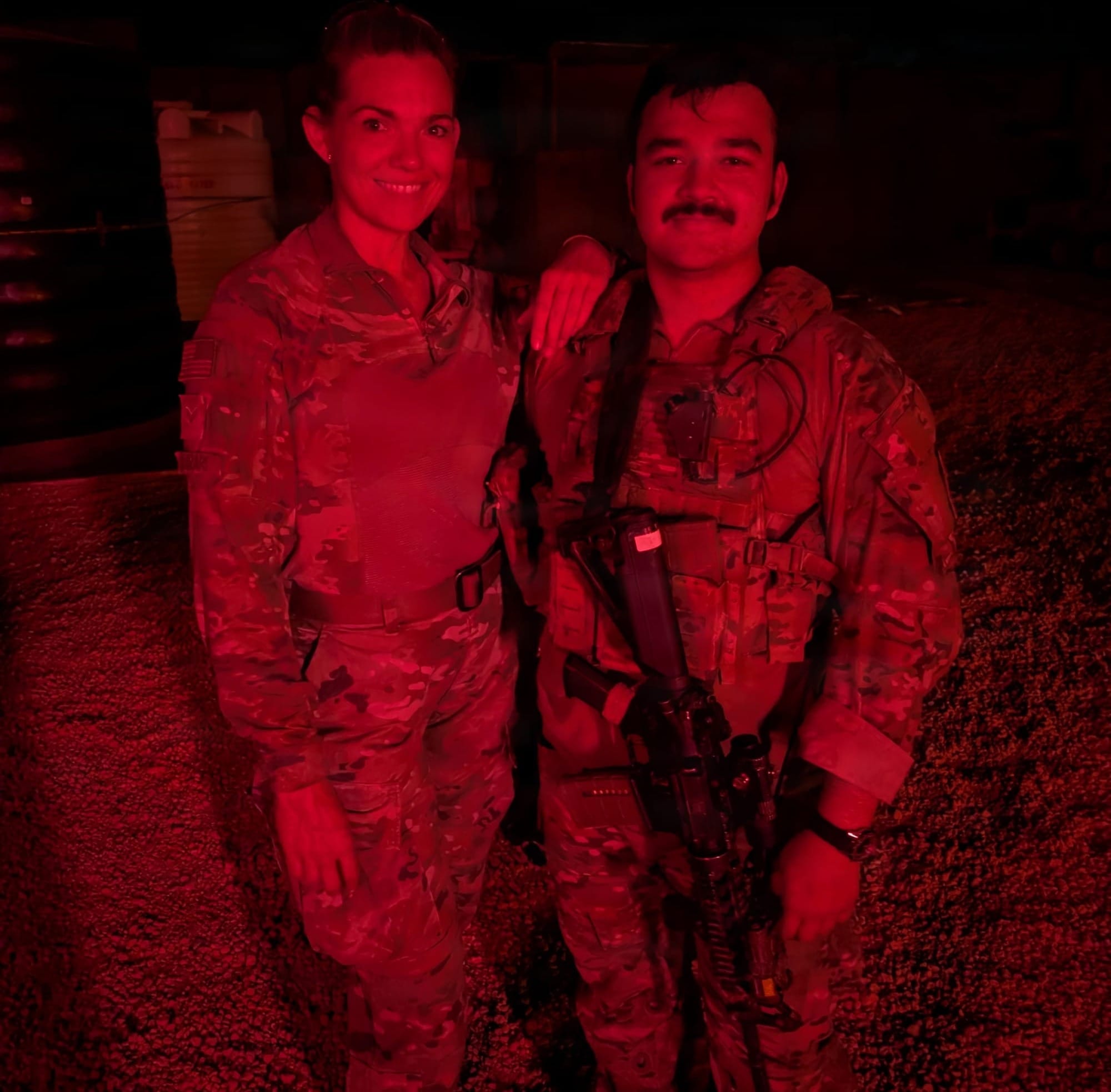 U.S. Air Force Senior Airman Michelle Ferrari stands beside her son, U.S. Army Spc. Nicolas Ferrari, during their reunion while deployed in East Africa.