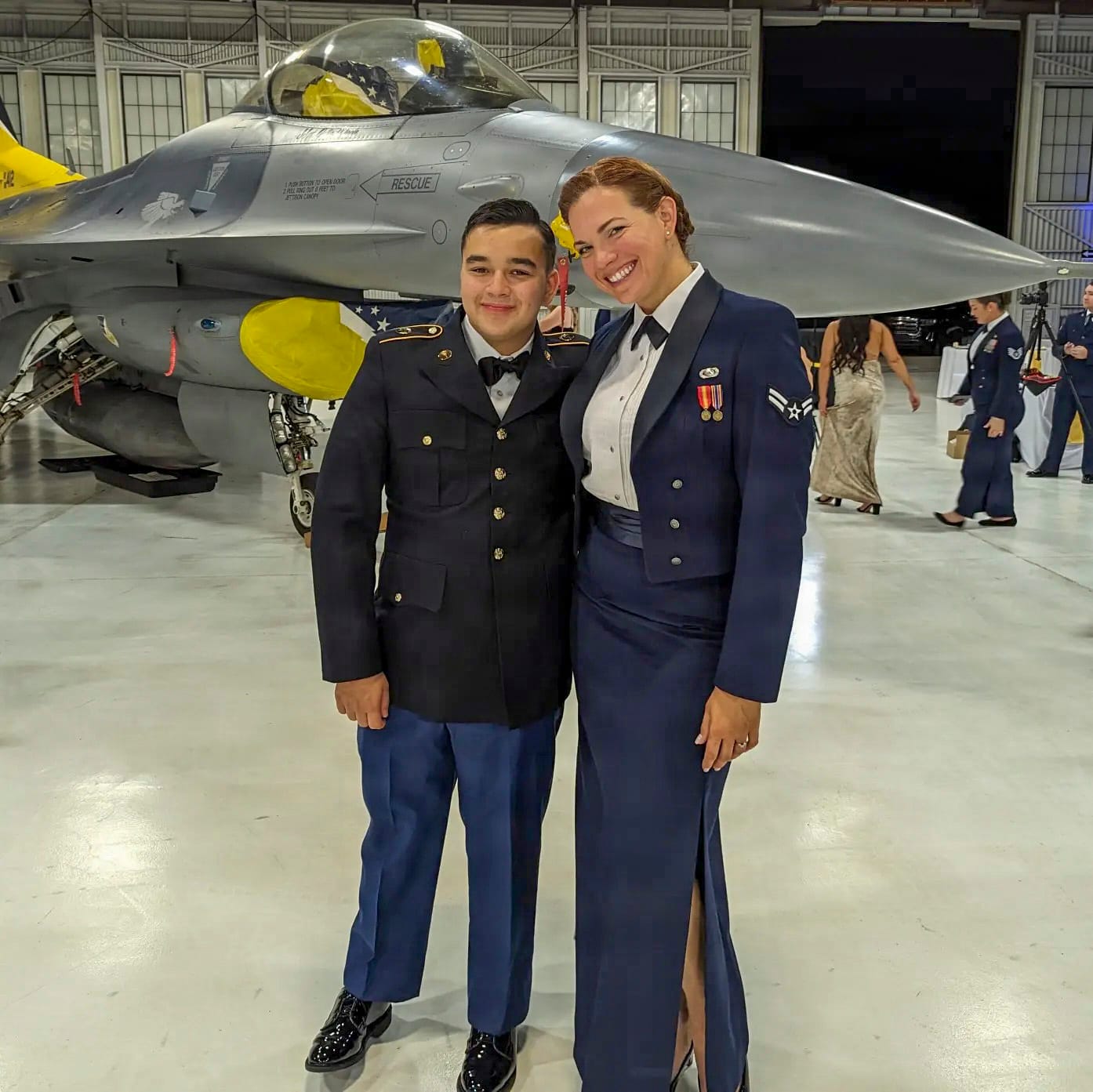 U.S. Air Force Airman 1st Class Michelle Ferrari stands beside her son, Army cadet Nicolas Ferrari, during the 49th Wing Air Force Ball at Holloman Air Force Base in 2023.