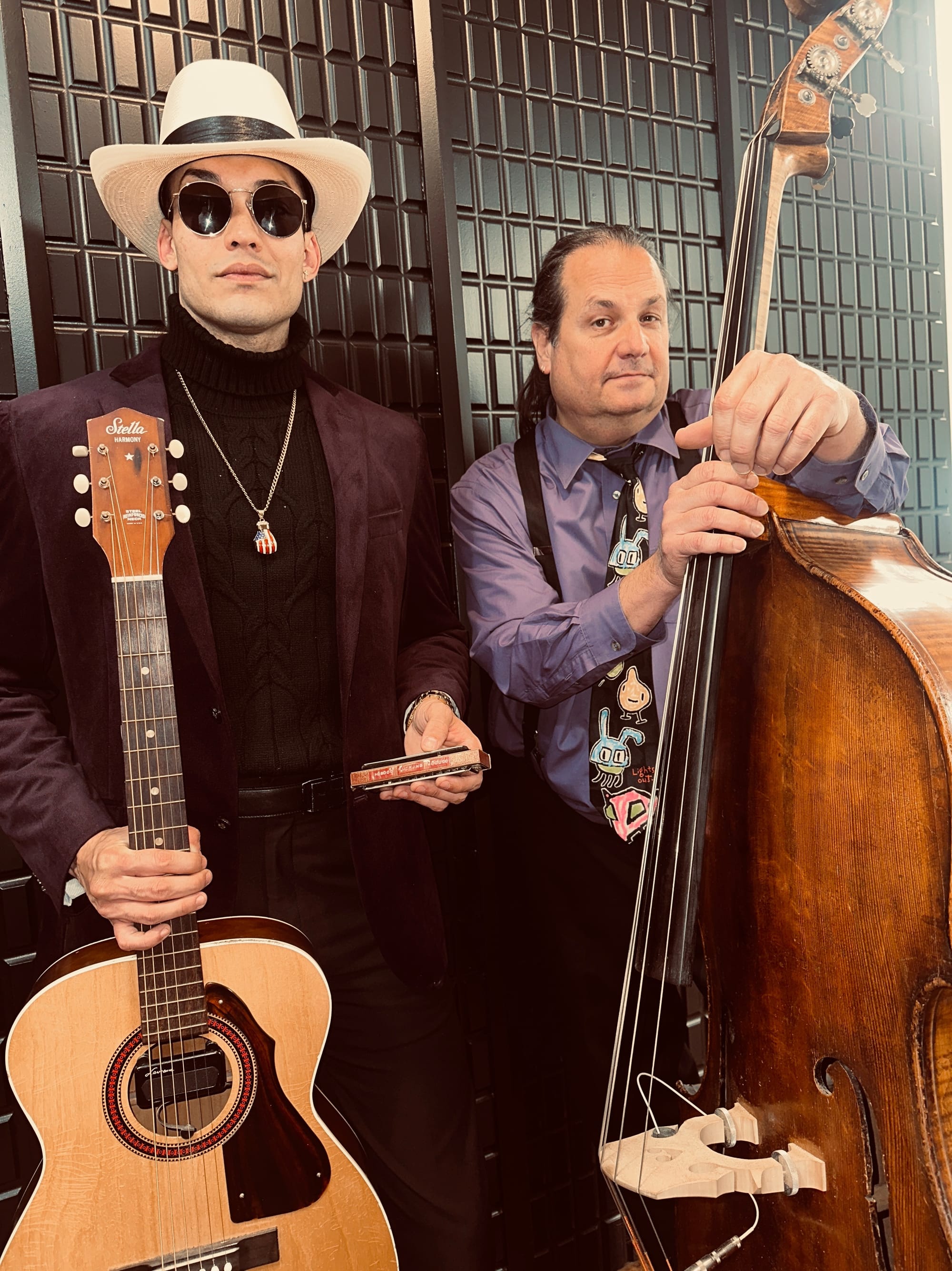 Musicians Sam Barlow and Sean Thoman Frankhouser pose with a guitar and upright bass.