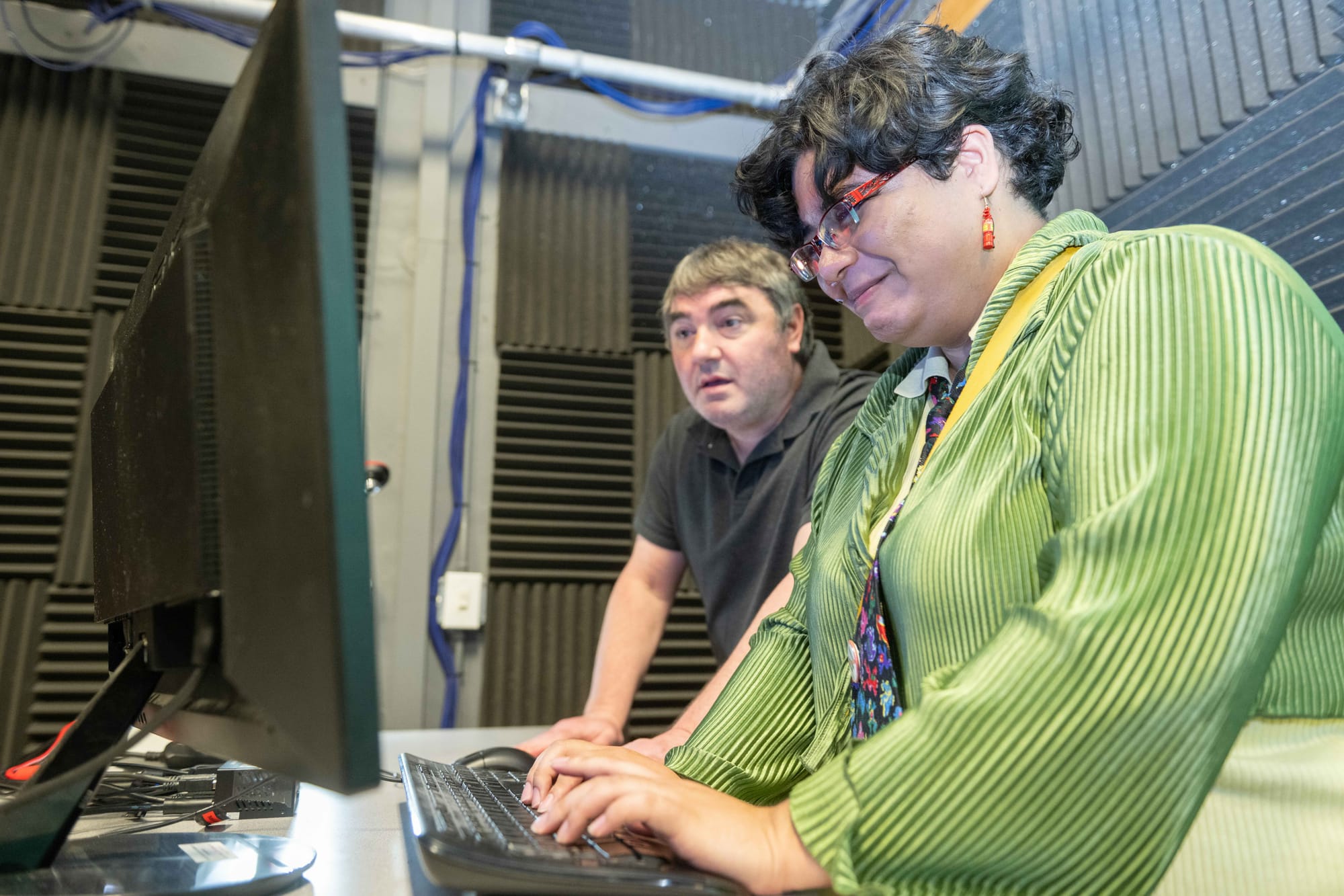 NMSU 2D animation professor Eddie Bakshi works with graduating senior Trevin Morales inside a studio at New Mexico State University’s Creative Media Institute.