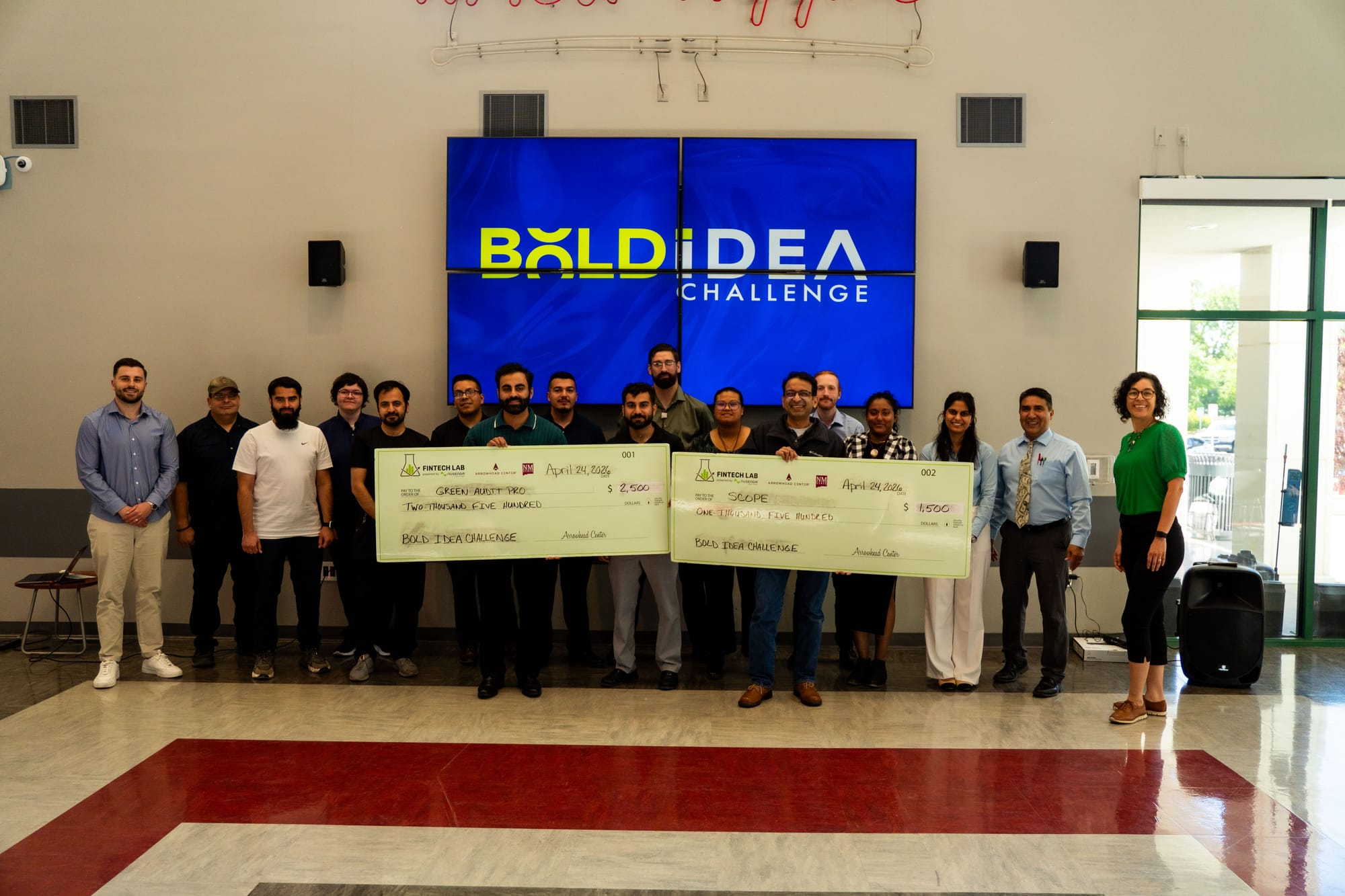 Participants in NMSU’s Bold Idea Challenge pose with oversized prize checks during the entrepreneurship competition hosted by Arrowhead Center’s Nusenda Fintech Lab.