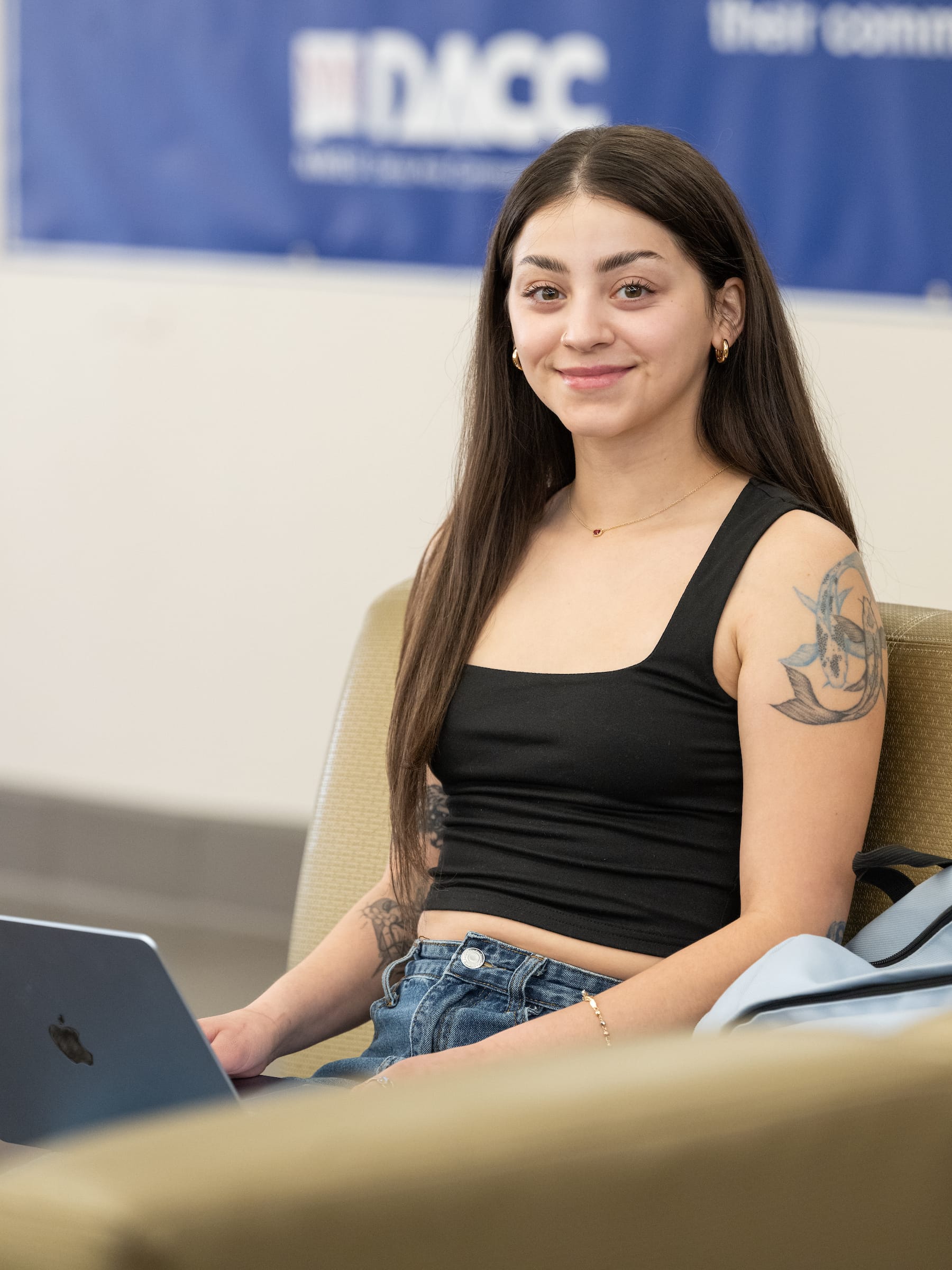 Kassandra Dominguez, one of the first students in the DACC-to-ACES Aggie Pathway program, poses for a portrait indoors at New Mexico State University.