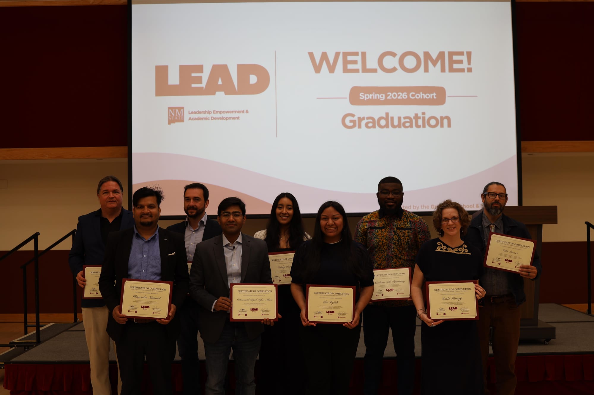 Members of New Mexico State University’s inaugural LEAD spring 2026 cohort pose with completion certificates during a graduation ceremony on campus.