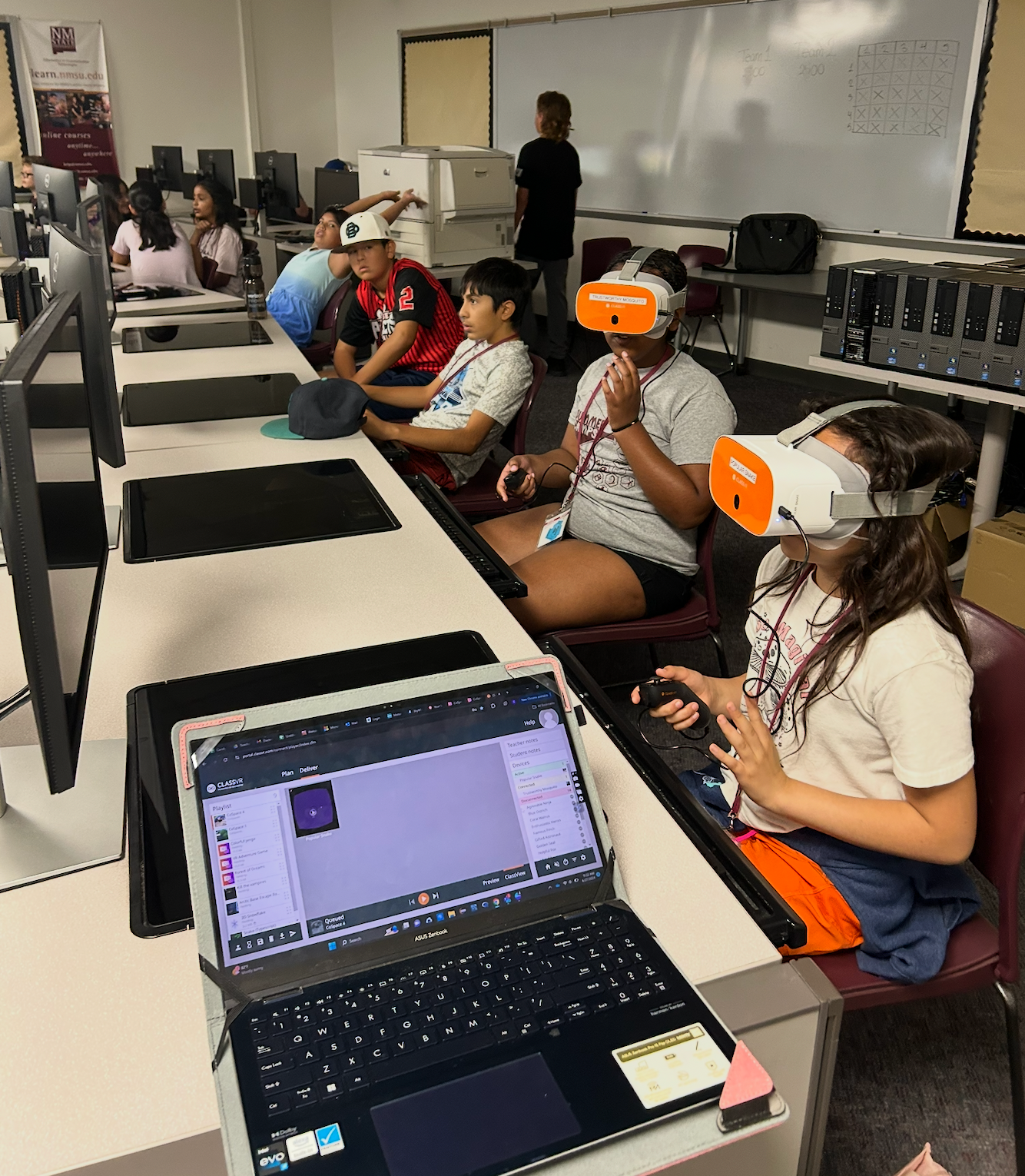 Middle school students use virtual reality headsets during a STEM Achievers summer camp session at New Mexico State University.