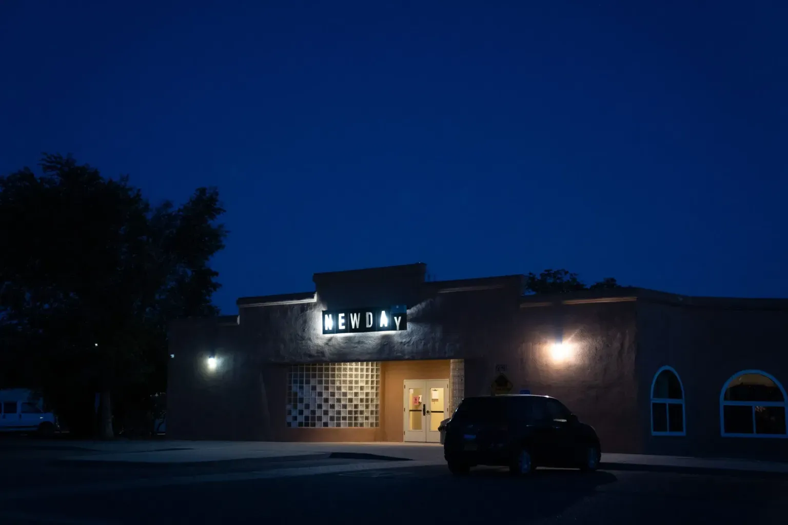 Exterior of the New Day shelter in Albuquerque at night, where children in state custody have reportedly been sent to sleep before returning to CYFD offices during the day.