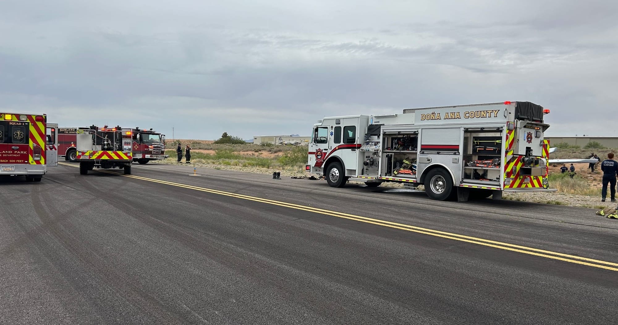 Fire trucks and emergency crews respond along a runway after a plane crash at Santa Teresa International Jetport.