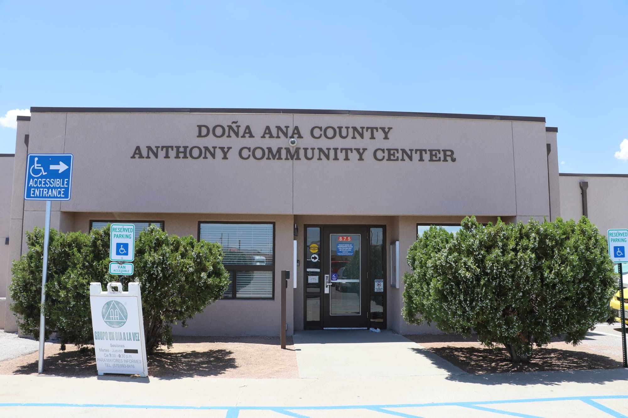 Exterior of the Anthony Community Center, with the facility name above the entrance and accessible parking signs in front.