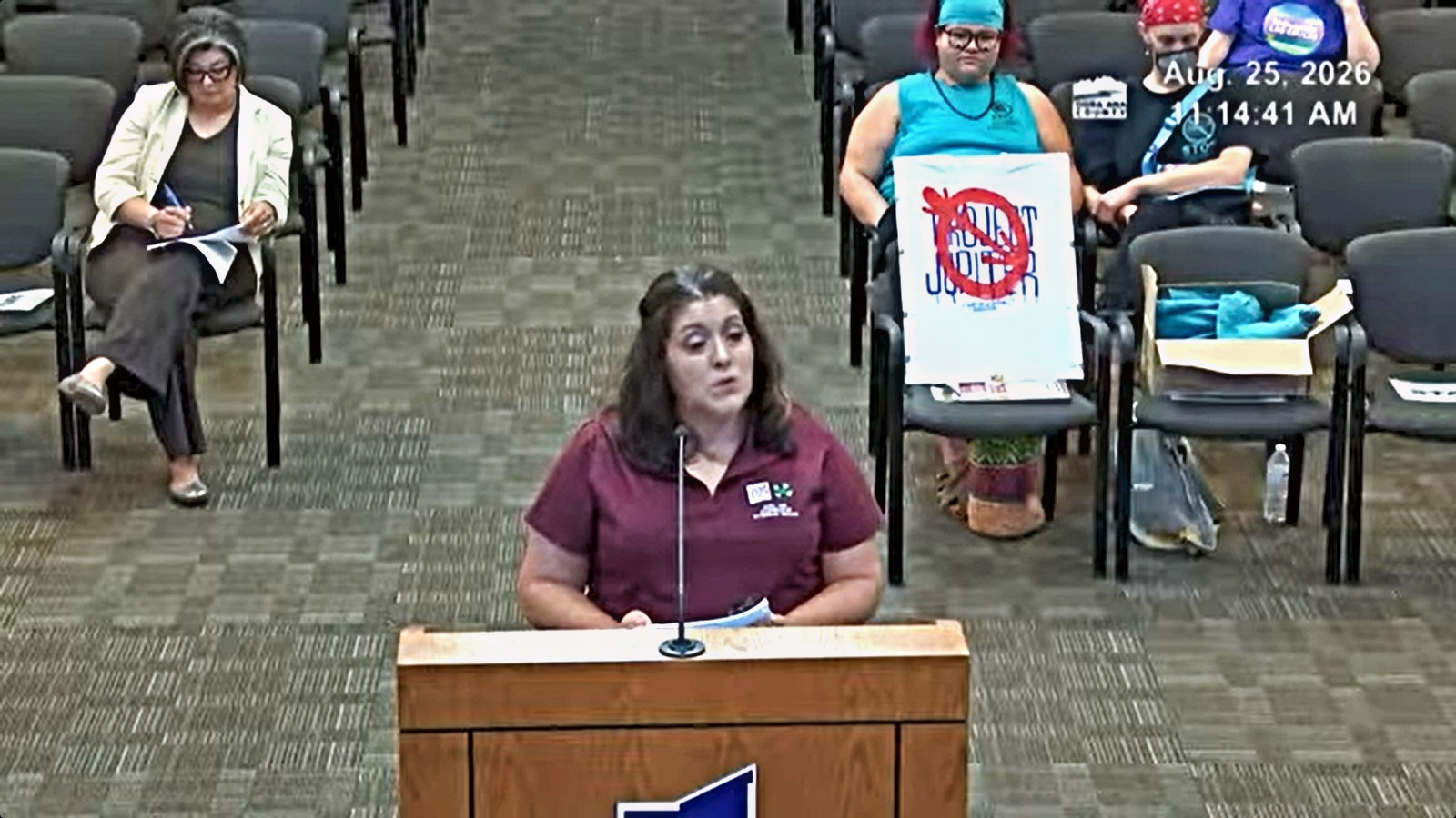 Eva Madrid of the Doña Ana County Cooperative Extension Service speaks at a lectern during an Aug. 25, 2026, County Commission meeting.