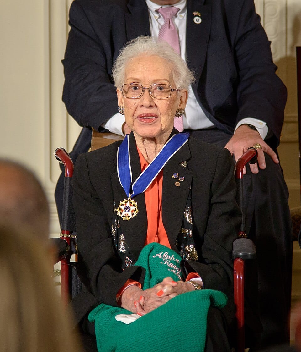 Katherine Johnson sits wearing the Presidential Medal of Freedom during a White House ceremony in 2015.