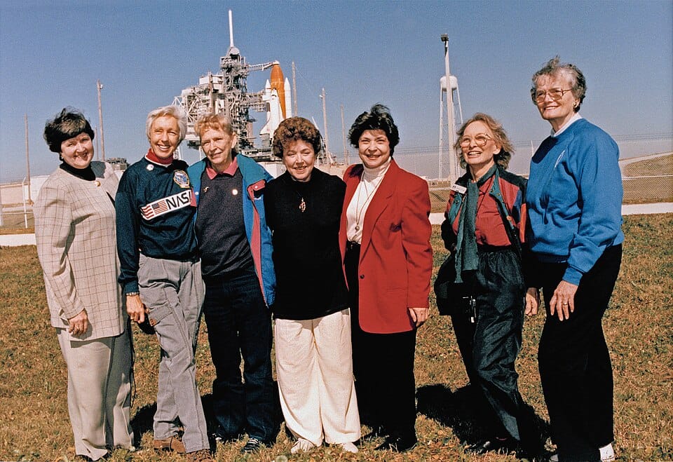 Seven members of the Mercury 13 gather during a visit to a space center. The pioneering women pilots will enter the International Space Hall of Fame Oct. 3.