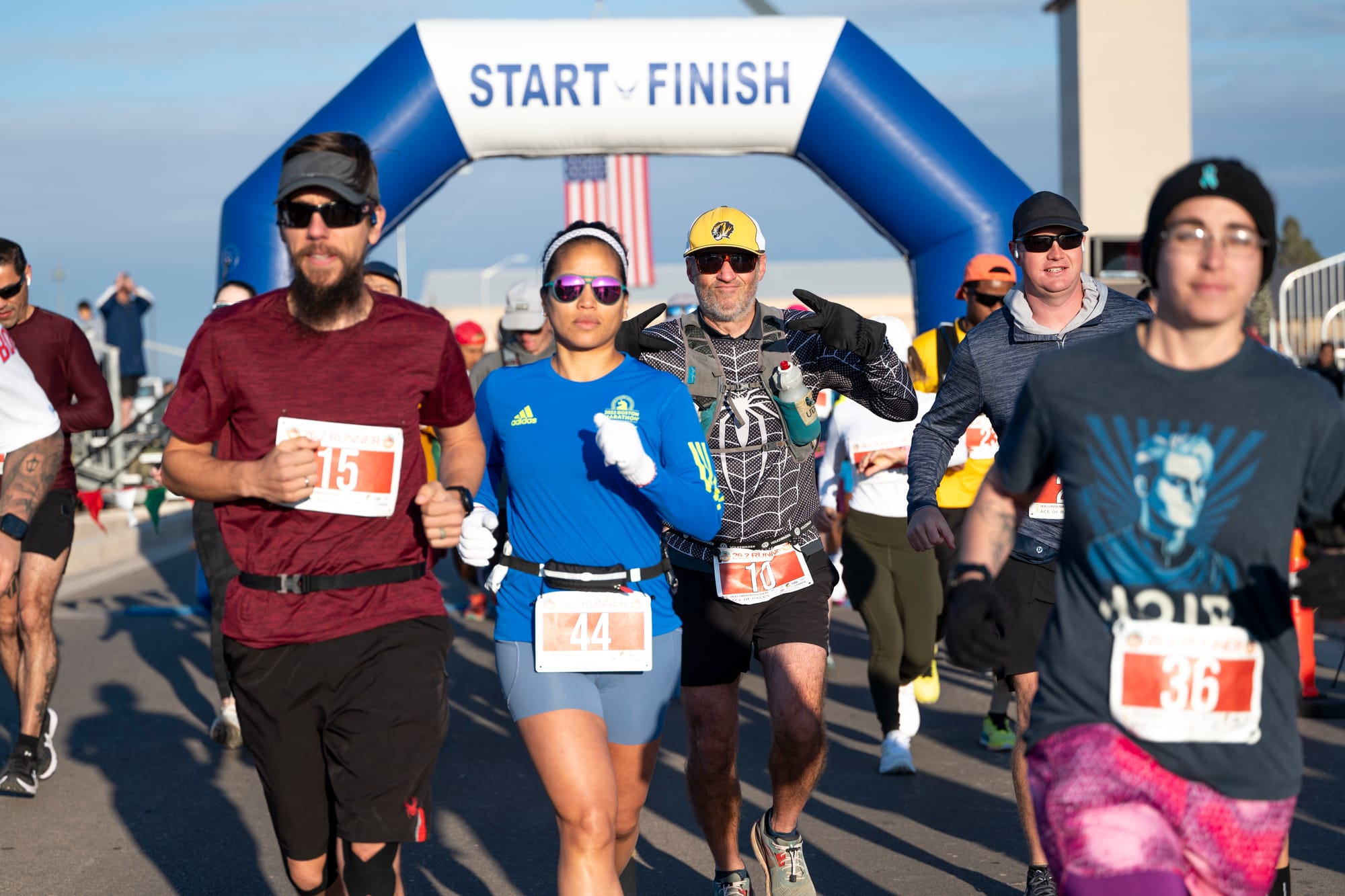 Runners cross the start-finish line during a previous Ace of Races event at Holloman Air Force Base.