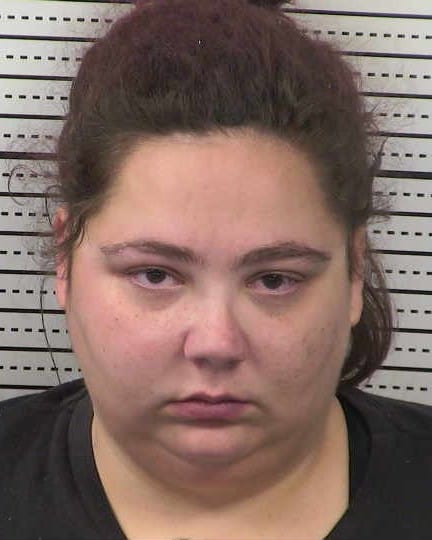 Booking photograph of Angela Gomez Luera, 26, facing forward against a height chart at the Doña Ana County Detention Center.