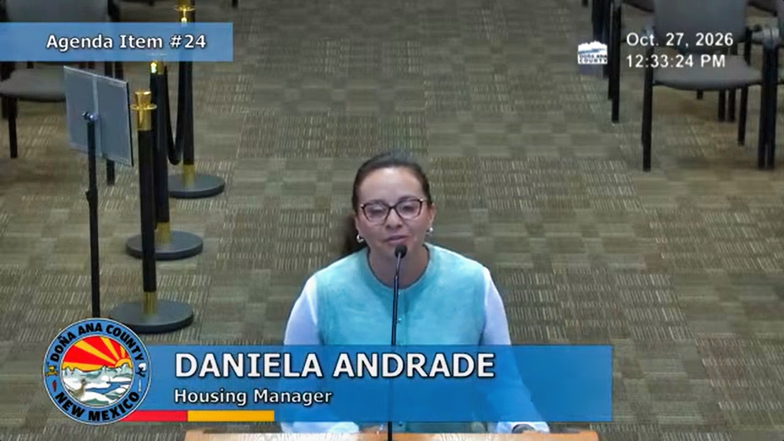 Doña Ana County Housing Manager Daniela Andrade speaks at a microphone during the Oct. 27 commission meeting about proposed affordable housing ordinance changes.