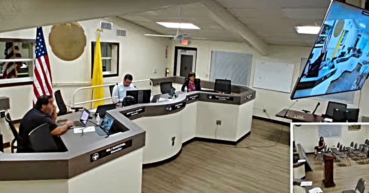 Sunland Park City Council members sit at their desks during an Oct. 20 meeting, with a large video screen and an inset view of the council chambers.