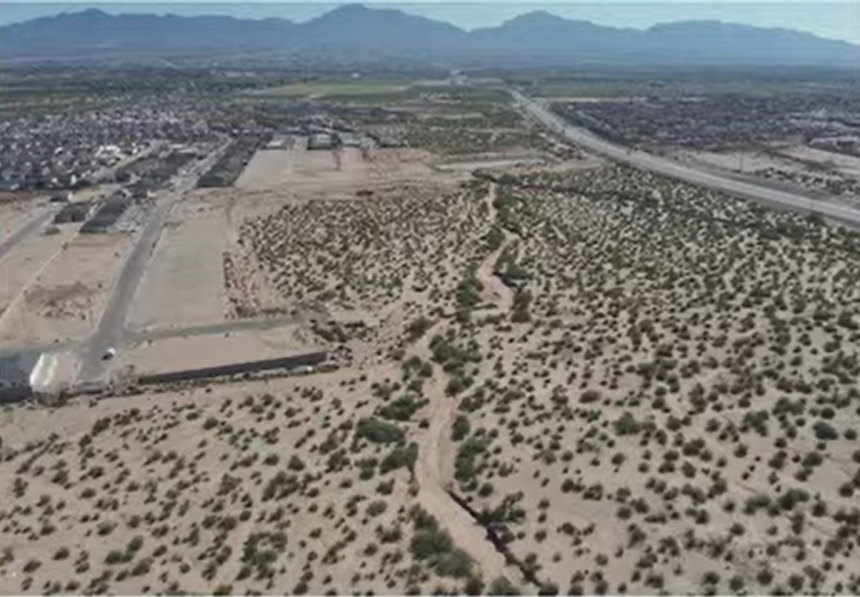 Aerial view of undeveloped desert land near existing homes and roads in Sunland Park, presented as part of the Valencia Park Unit 12 lot-width variance request.