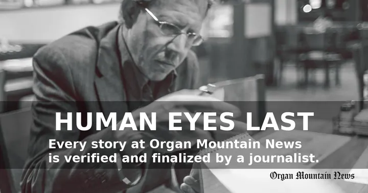 Black-and-white photo of a journalist writing in a notebook with overlay text: “Human Eyes Last” and Organ Mountain News logo.