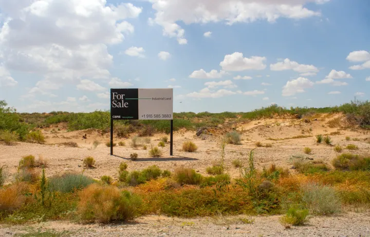 A “for sale” sign marks land in Santa Teresa, New Mexico, where BorderPlex plans to build a $165 billion data center.