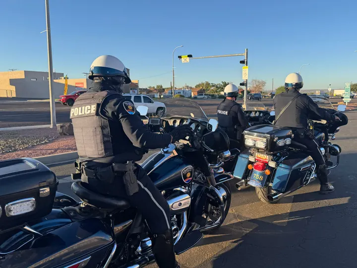 Three Las Cruces police officers on motorcycles prepare to begin a morning traffic enforcement operation on E Lohman Avenue.