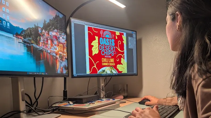 A New Mexico State University student designs product packaging for Oasis Desert Chips as part of an Arrowhead Center internship focused on technology commercialization.