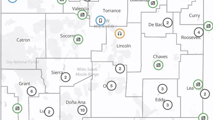 A statewide map of New Mexico showing county boundaries marked with icons and numbers that indicate the distribution of local news outlets across the state.