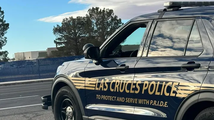 Las Cruces Police Department patrol SUV parked along a roadway, with department name and “To Protect and Serve With P.R.I.D.E.” visible on the side.