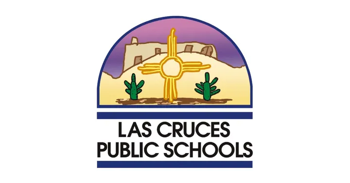 Las Cruces Public Schools logo featuring a Zia sun symbol set against desert hills, two green cacti, and a stylized building under a purple and gold sky.