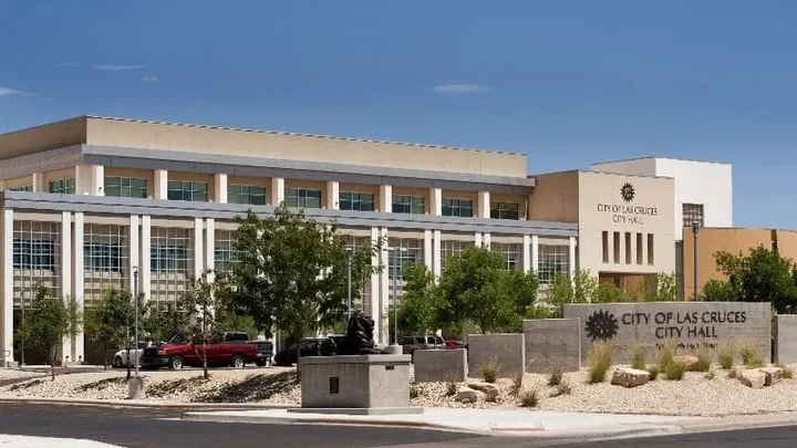 Las Cruces City Hall building and entrance sign along Main Street in downtown Las Cruces.