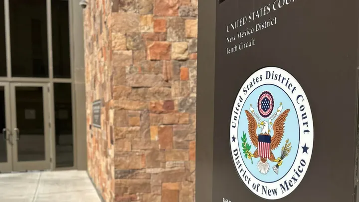 Exterior sign for the U.S. District Court for the District of New Mexico in Las Cruces outside the federal courthouse building.