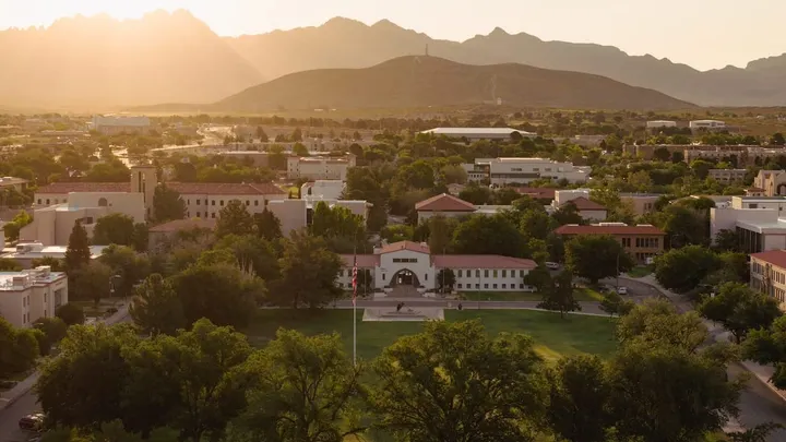 Hadley Hall on the New Mexico State University campus in Las Cruces, with the Organ Mountains visible in the background