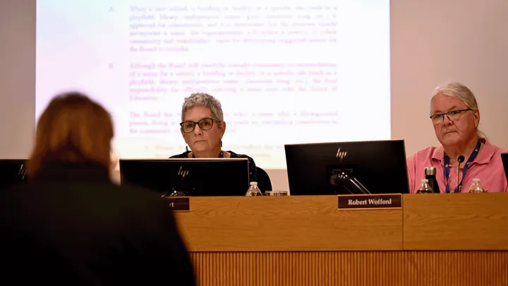 Las Cruces Public Schools Board of Education President Pamela Cort and Vice President Robert Wofford sit at a dais during a March 24, 2026, meeting discussing renaming César Chávez Elementary