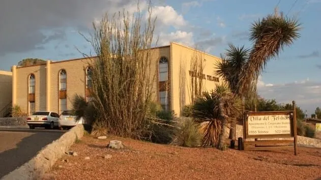 Exterior view of Villa del Telshor apartment complex on South Telshor Boulevard in Las Cruces