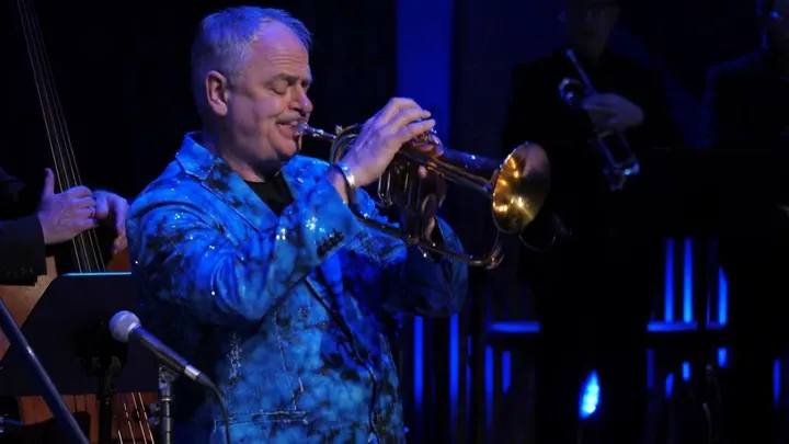 Trumpet player Jens Lindemann performs on stage during a live concert.