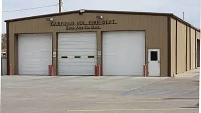  Exterior view of the Garfield Volunteer Fire Department building with three garage bays in Doña Ana County.