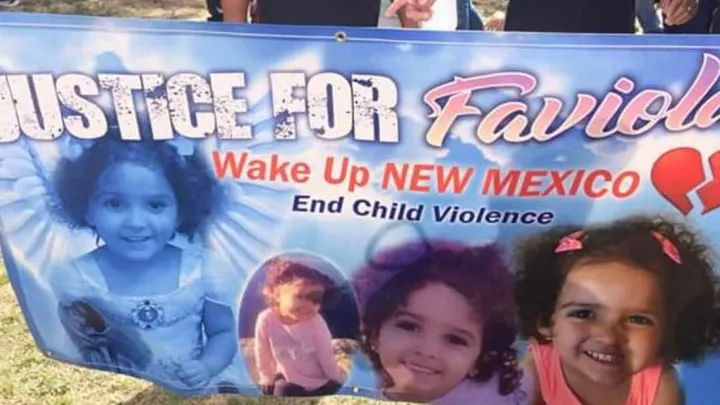 A banner displays photos of 2-year-old Faviola Rodriguez alongside messages calling for justice and an end to child violence.