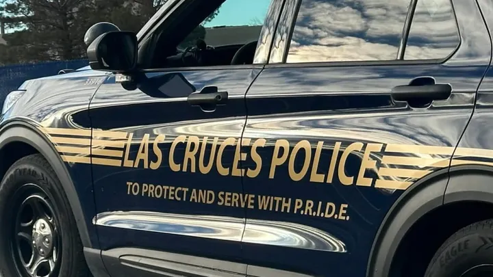 A marked Las Cruces Police Department SUV parked outdoors during daylight hours