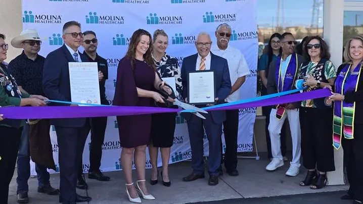 Community leaders and Molina Healthcare representatives cut a ribbon during the opening ceremony for the Molina One Stop Help Center in Las Cruces.