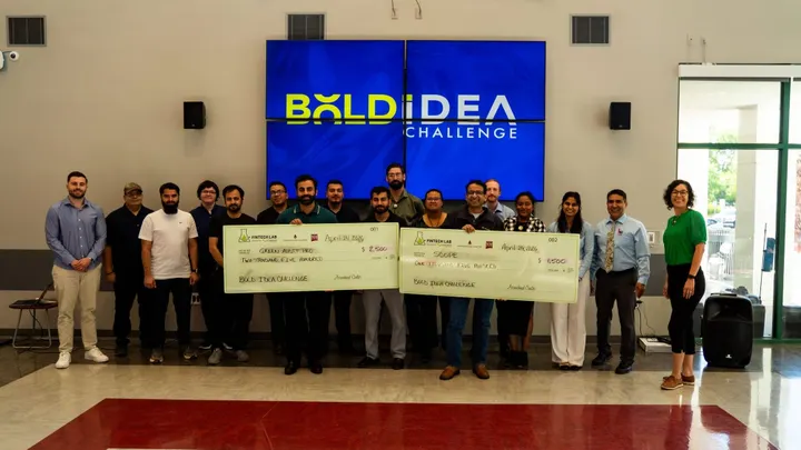 Participants in NMSU’s Bold Idea Challenge pose with oversized prize checks during the entrepreneurship competition hosted by Arrowhead Center’s Nusenda Fintech Lab.