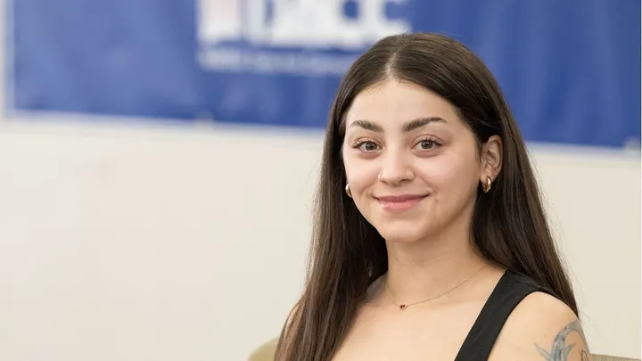 Kassandra Dominguez, one of the first students in the DACC-to-ACES Aggie Pathway program, poses for a portrait indoors at New Mexico State University.