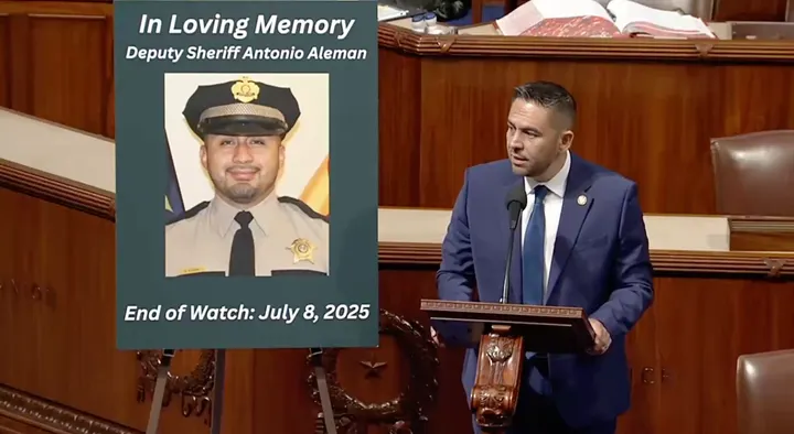 U.S. Rep. Gabe Vasquez delivers remarks on the House floor beside a memorial display honoring Deputy Sheriff Antonio Aleman